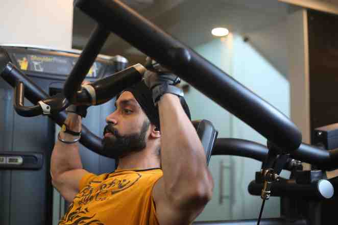 Man using exercise equipment